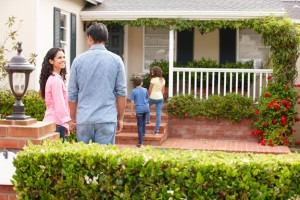 Hispanic family outside home for rent